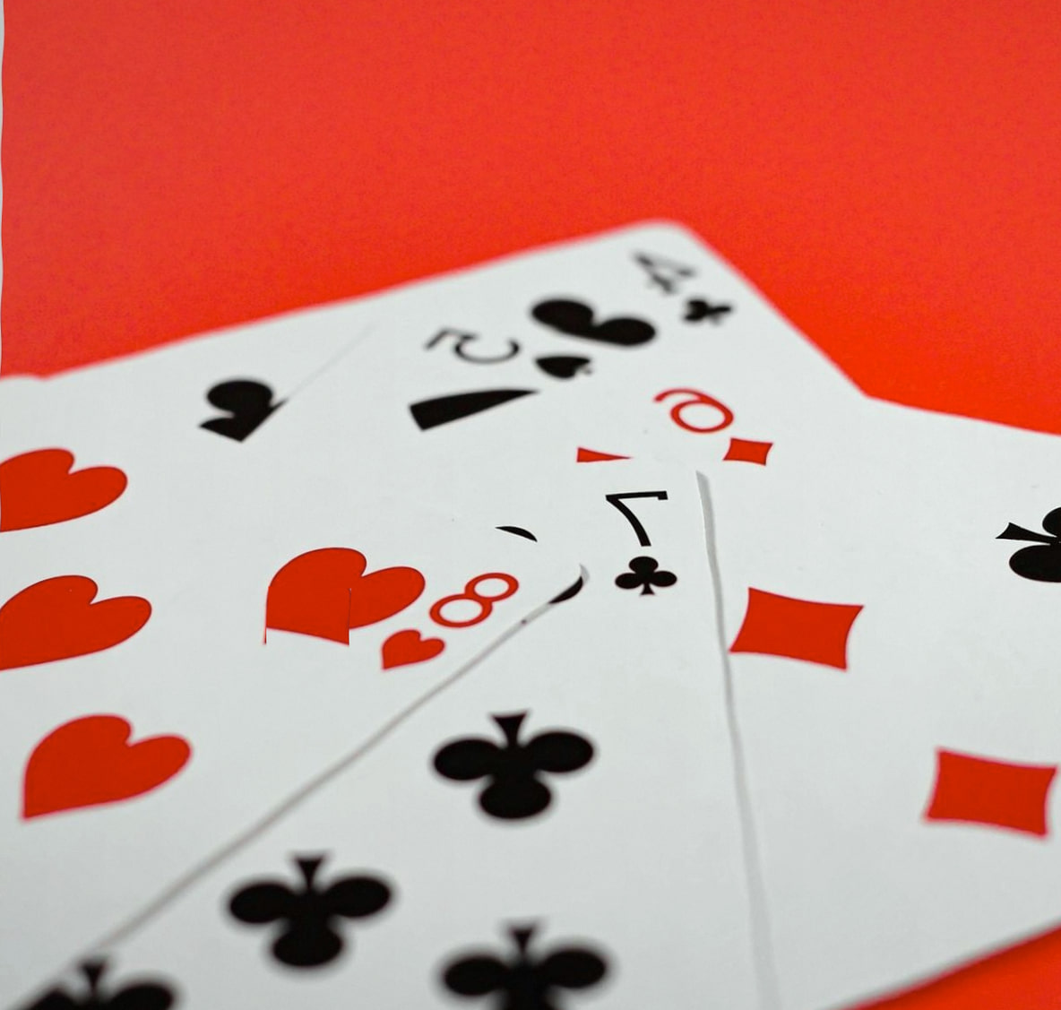 Poker chips and cards on a green felt table